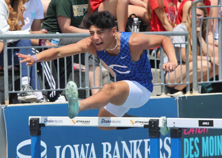 Columbus’ Dante Zuniga goes over a hurdle during the Wildcats shuttle hurdles at the Iowa High School Track and Field Championship. The Wildcats finished third in the final. (Hunter Moeller/The Union)