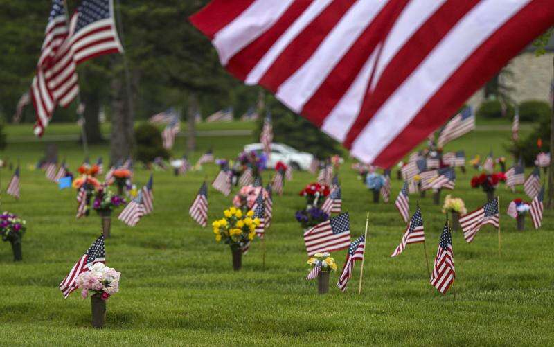 Photos: Memorial Day flag placement at Cedar Memorial Cemetery