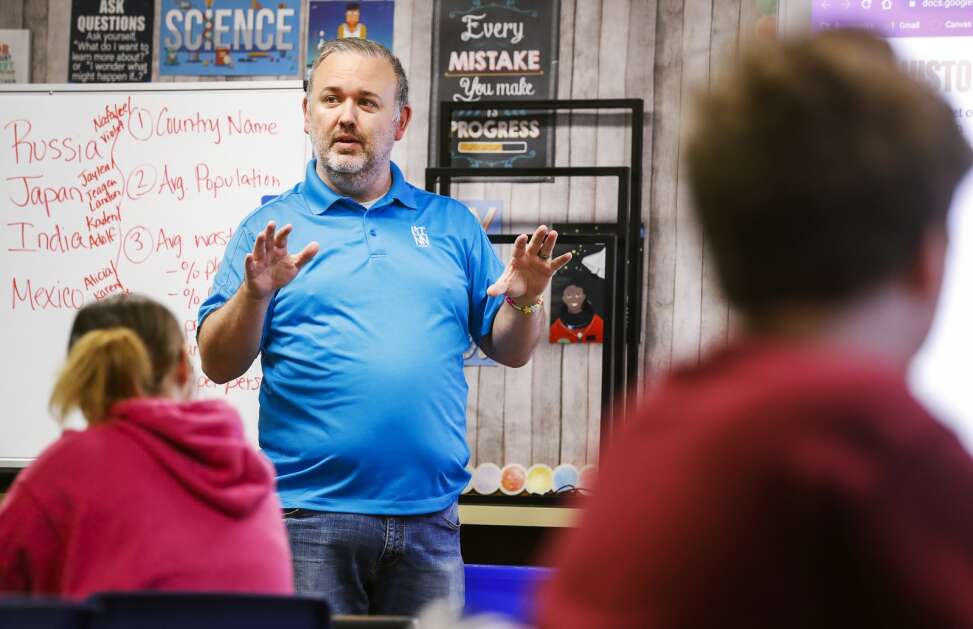 Linn County Associate Combination Inspector Ryan Sampica gives a presentation on building codes, building practices and how they relate to natural disasters to Valerie Sampica's sixth grade class at Roosevelt Creative Corridor Business Academy in southwest Cedar Rapids on Friday. (Jim Slosiarek/The Gazette)