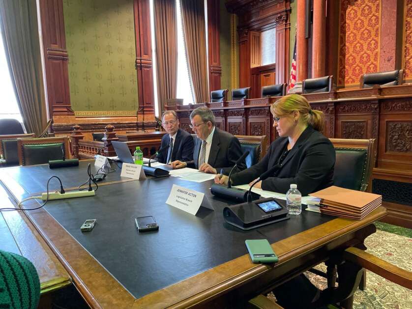 From left, Jeff Plagge, Kraig Paulsen and Jennifer Acton, members of Iowa's Revenue Estimating Conference, are seated during a meeting on Friday at the State Capitol in Des Moines. (Caleb McCullough/Gazette-Lee Des Moines Bureau)