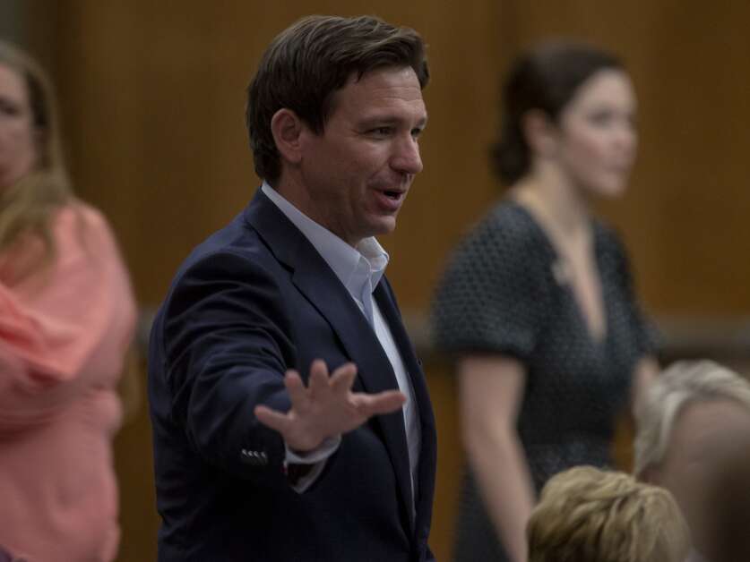 Florida Gov. Ron DeSantis waves to supporters during an event at the Kirkwood Hotel in Cedar Rapids, Iowa on Saturday, May 13, 2023.(Nick Rohlman/The Gazette)