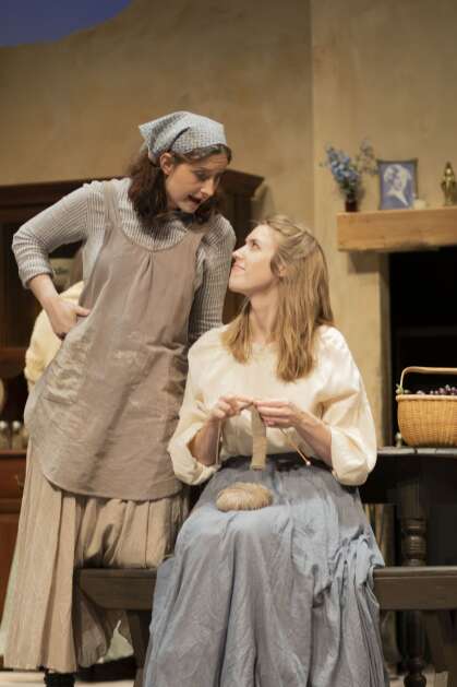 Noel VanDenBosch (right) looks up at McKayla Sturtz, playing her sister Maggie, in "Dancing at Lughnasa," onstage through Monday at the Coralville Center for the performing Arts. This marks VanDenBosch's final Corridor acting role before moving to Washington, D.C., later this summer or early fall. She got her start in a City Circle Theatre Company show in 2008, so she's come full circle appearing in this City Circle production. (Coralville Center for the Performing Arts)
