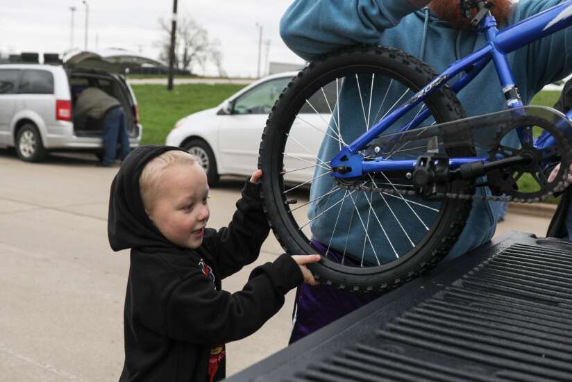 Cedar Rapids foster children receive new bikes and helmets 