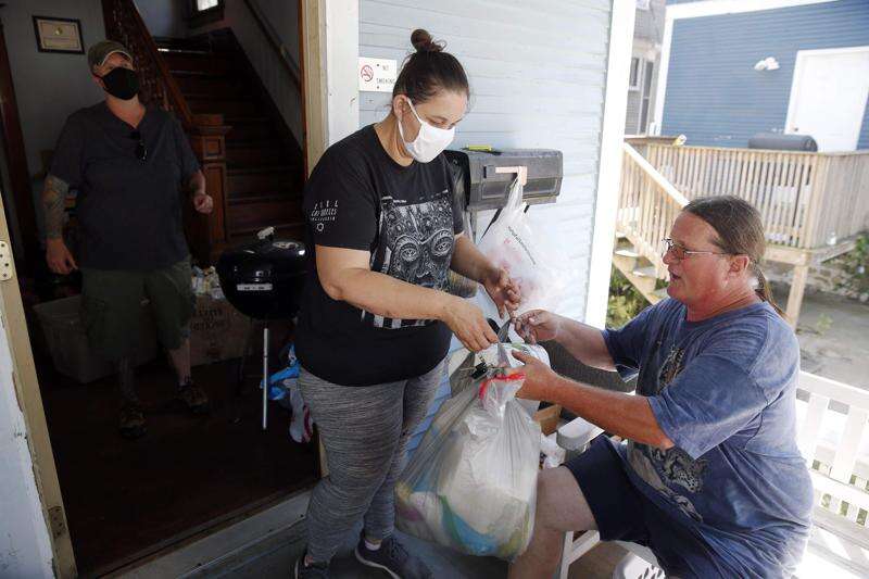 ‘On our own’ after the derecho, Wellington Heights residents band together to feed neighbors