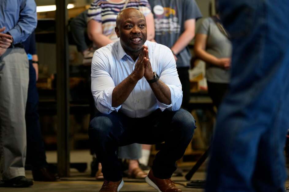 Republican presidential candidate South Carolina Sen. Tim Scott looks on as he is introduced to speak  Wednesday at Siouxland Christian school in Sioux City. (Charlie Neibergall/Associated Press) 