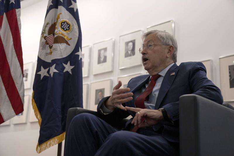 US ambassador Terry Branstad defends tough approach to China in AP interview