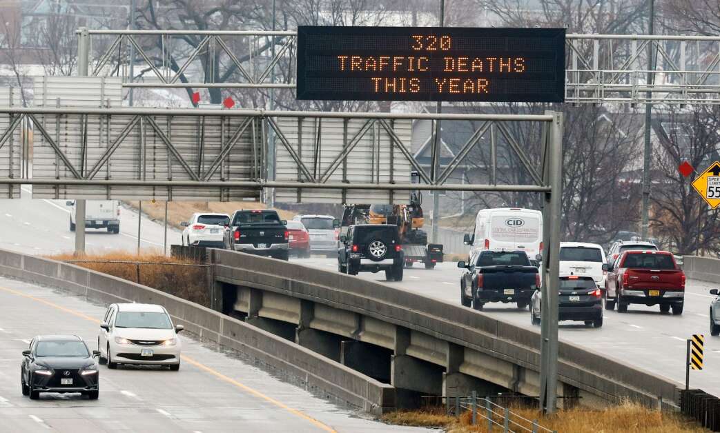 A sign showing the number of Iowa traffic deaths to date in 2022 is seen Dec. 9, 2022, on an Iowa Department of Transportation message board over the northbound lanes of Interstate 380 in southwest Cedar Rapids. (Jim Slosiarek/The Gazette)