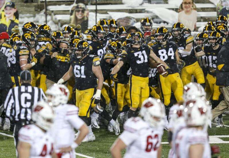 No. 16 Iowa 28, Wisconsin 7: From snoozer to snow angels, Hawkeyes finally have Heartland Trophy