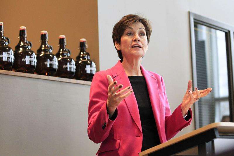 Kim Reynolds defends Iowa utilities, energy efficiency changes
