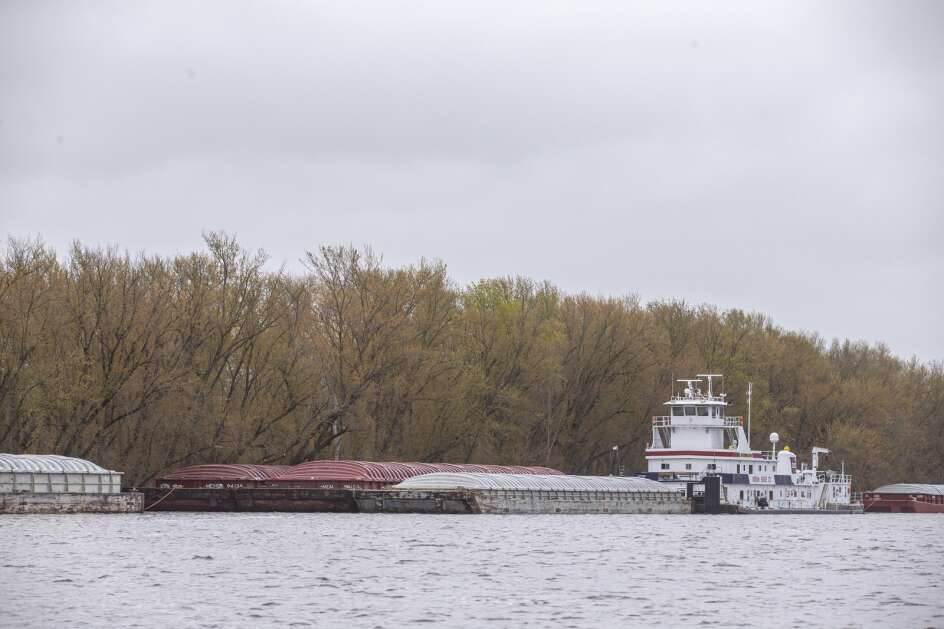 Barges are moored near McGregor, Iowa on Sunday, April 30, 2023. Barge traffic along the river is halted due to the high water. (Nick Rohlman/The Gazette)