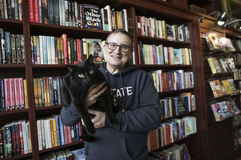 Bookstore cat opens his own book section at Next Page Books in Cedar Rapids