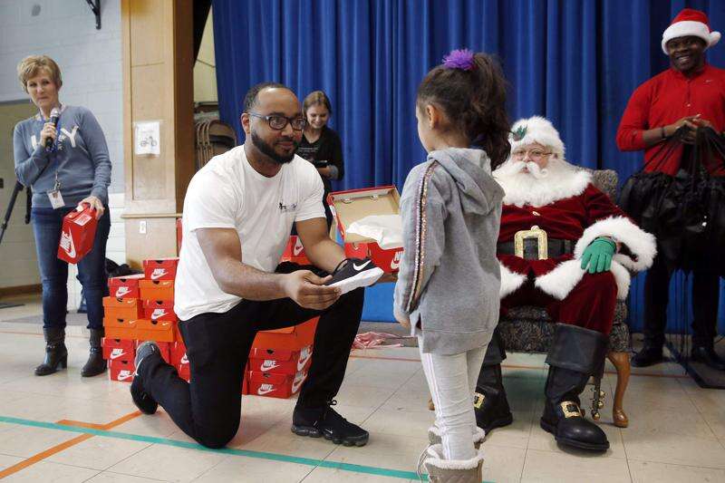 Photos: Garfield School students get new Nikes from Santa (and Hawkeye Andre Dawson)