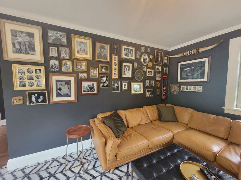 Horn’s family room features a wall with a large collage of family portraits spanning many decades. (Photo Submitted)