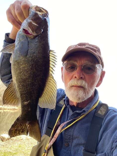Orlan Love poses Monday with a smallmouth bass caught at the mouth of a Wapsipinicon River tributary. (Orlan Love/correspondent)