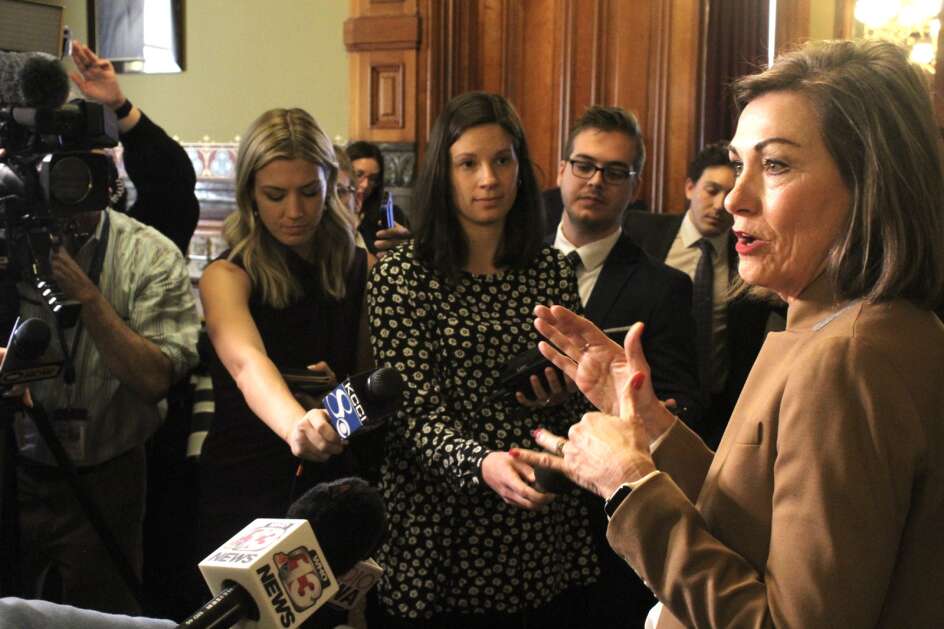 Iowa Gov. Kim Reynolds speaks to reporters in the governor's formal office at the Iowa Capitol in Des Moines on Tuesday, April 4, 2023. Photo by Erin Murphy.