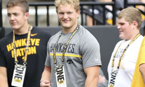 Iowa football recruit a star in wrestling and basketball, too