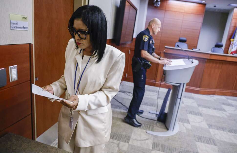 Cedar Rapids Community School District Superintendent Tawana Grover folds her typed statement after speaking  Tuesday during a news conference at the Educational Leadership and Support Center in northwest Cedar Rapids. Grover and Cedar Rapids police Capt. Charlie Fields spoke about the threat to students made on social media after classes were canceled Monday. The arrest of a teen was announced Thursday night. (Jim Slosiarek/The Gazette)