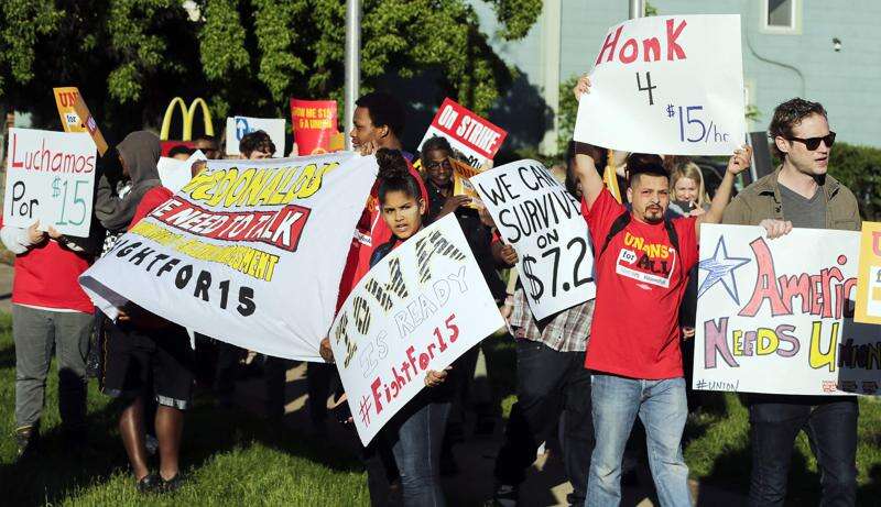 Cedar Rapids McDonald’s employees, demonstrators call for chain to serve up higher wages, union rights