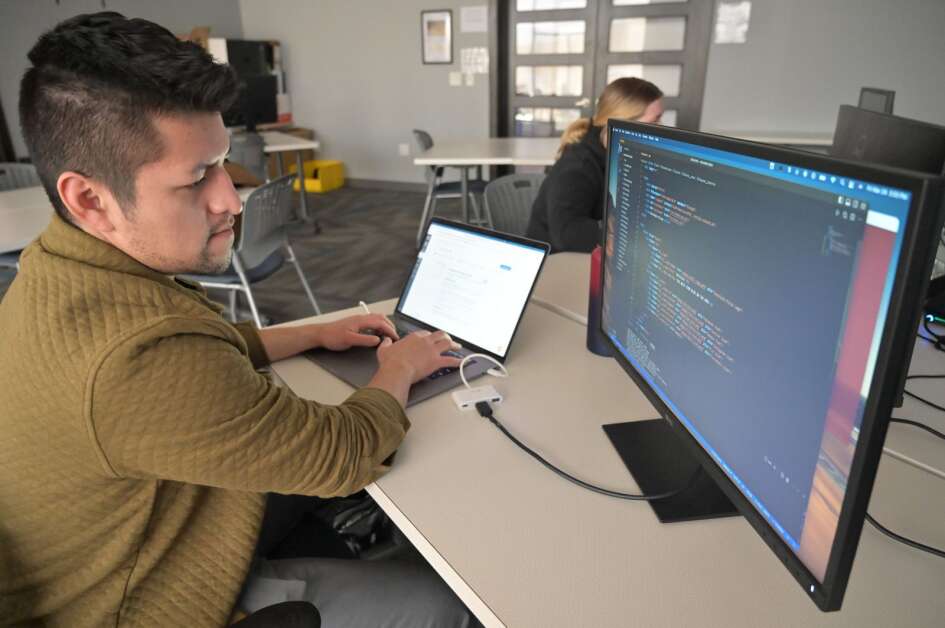 Bryan Gonzalez works on a class assignment during a DeltaV class in April at the Geonetric Building, 415 12th Ave. SE, in Cedar Rapids. Gonzalez went from student to teacher when he began teaching Code 101 classes in Cedar Rapids this month, as part of DeltaV's effort to reach more members of the community.  (Rob Merritt/NewBoCo) 