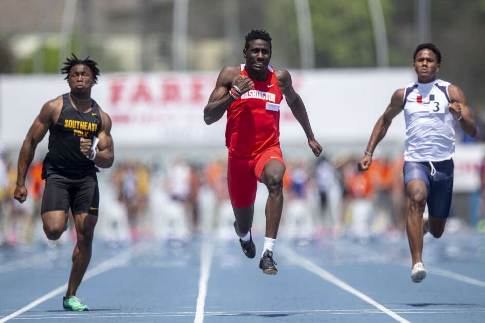 Cedar Rapids Washington’s Miles Thompson (center), Southeast Polk’s Abu Sama (left), and Urbandale’s Ryan Marshall (right) compete in the Class 4A boys’ state track and field 100-meter dash Saturday at Drake Stadium in Des Moines. (Nick Rohlman/The Gazette)