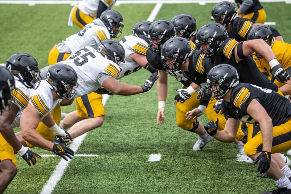 Iowa offensive (right) and defensive (left) linemen face off during spring practice at Kinnick Stadium in Iowa City on Saturday, April 22, 2023. (Nick Rohlman/The Gazette)