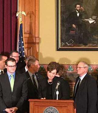 Gov. Reynolds signs Iowa water quality funding bill, her first bill signing