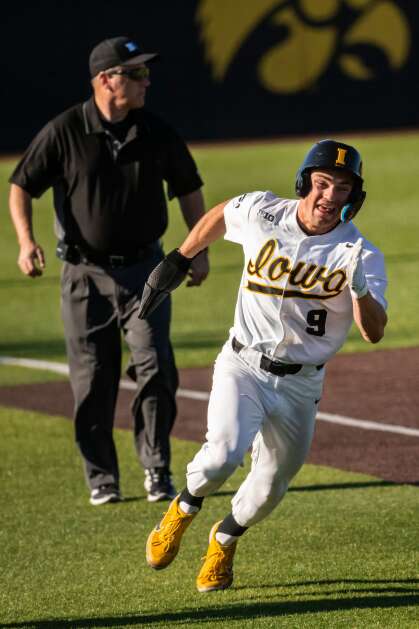 Iowa’s Kyle Huckstorf (9) heads for home during a home game earlier this season. (Nick Rohlman/The Gazette)