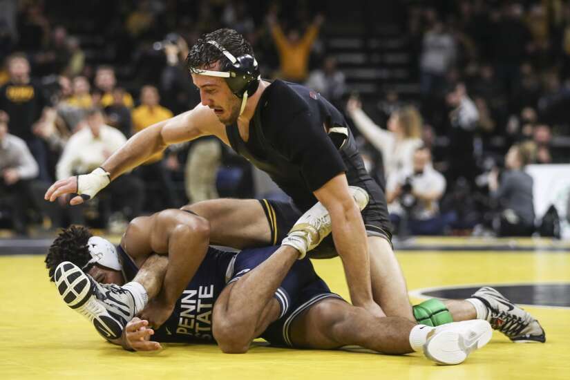 Top-ranked Penn State closes strong for 19-13 victory over No. 2 Iowa in battle between wrestling powers