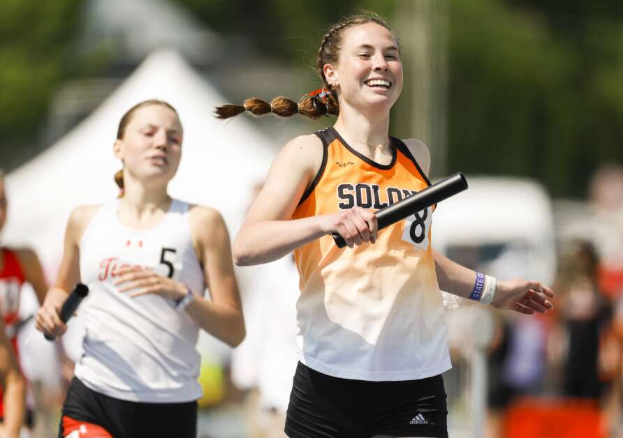 Solon’s Gracie Federspiel celebrates after crossing the finish line during the Class 3A girls’ state track and field distance medley relay Friday at Drake Stadium in Des Moines. (Jim Slosiarek/The Gazette)