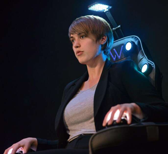 Noel VanDenBosch of Iowa City portrays Cindy, an artificial robot running on an artificial intelligence program. First mentioned in “The Summerland Project,” Cindy was fleshed out for “Aurora.” The drama was staged in August 2019 in the Grandon Studio at Theatre Cedar Rapids (Photo by Rob Merritt)