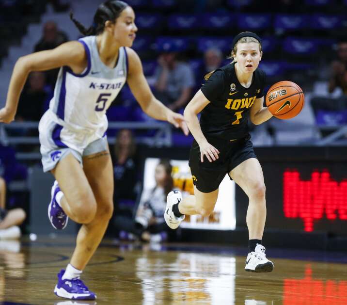 Iowa guard Molly Davis (1) moves the ball upcourt in the Hawkeyes’ loss at Kansas State last November. As Iowa assembles its 2023-24 schedule, a good possibility is a rematch in Iowa City. (Jim Slosiarek/The Gazette)