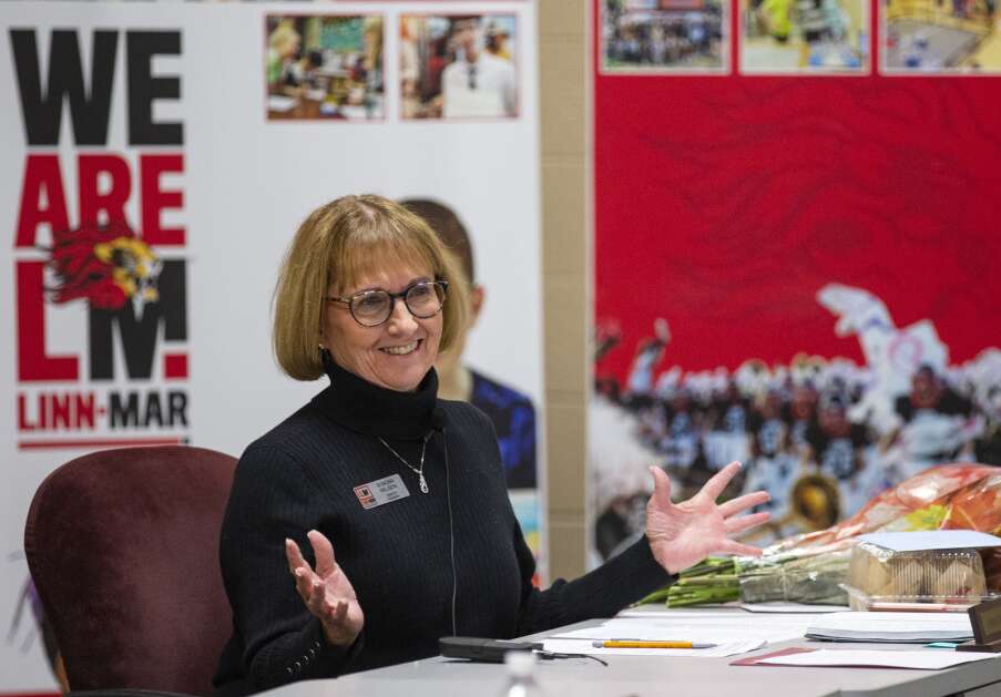 Linn-Mar school board member Sondra Nelson reacts as the crowd of community members claps for her at the Linn-Mar Community School District building in Marion, Iowa on Monday, Nov. 20, 2023. Nelson has 48 years of experience in the school district. (Savannah Blake/The Gazette)