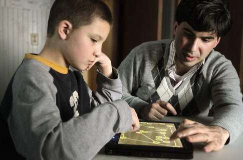 Touch-screen tablets help connect autistic kids with their families and world