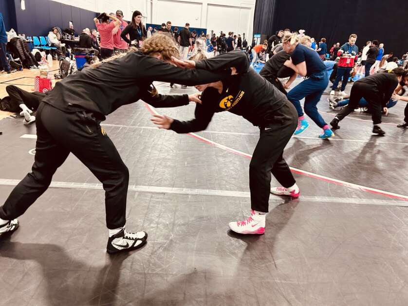 Hawkeye wrestlers Felicity Taylor and Eva Bayless warm up with other teammates before the challenge portion of the U.S. Olympic Trials on Friday, April 19, 2024 in State College, Pennsylvania.  (Vanessa Miller, The Gazette)