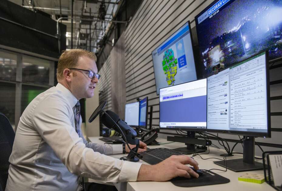Meteorologist Kaj O’Mara works on recording weather forecasts for radio stations from 3 a.m. to 4 a.m. at the KCRG studio in Cedar Rapids on Wednesday. During the time before the first morning show he also had to update the website and social media with forecasts and conditions. (Savannah Blake/The Gazette)