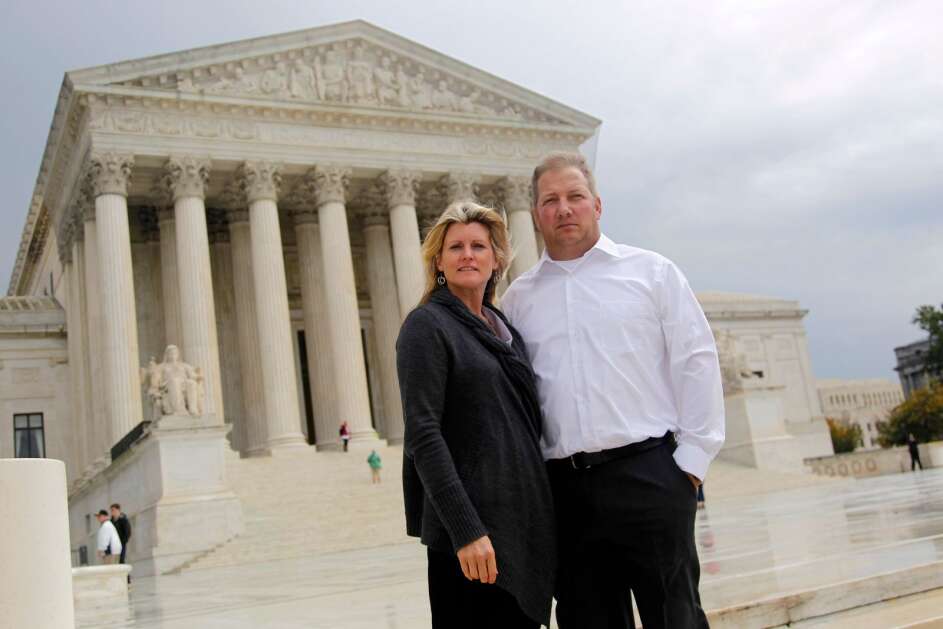 Michael and Chantell Sackett of Priest Lake, Idaho, pose for a photo in 2011 in front of the U.S. Supreme Court in Washington. The Supreme Court on Thursday made it harder for the federal government to police water pollution in a decision that strips protections from wetlands that are isolated from larger bodies of water. The justices boosted property rights over concerns about clean water in a ruling in favor of the Sacketts. (AP Photo/Haraz N. Ghanbari)