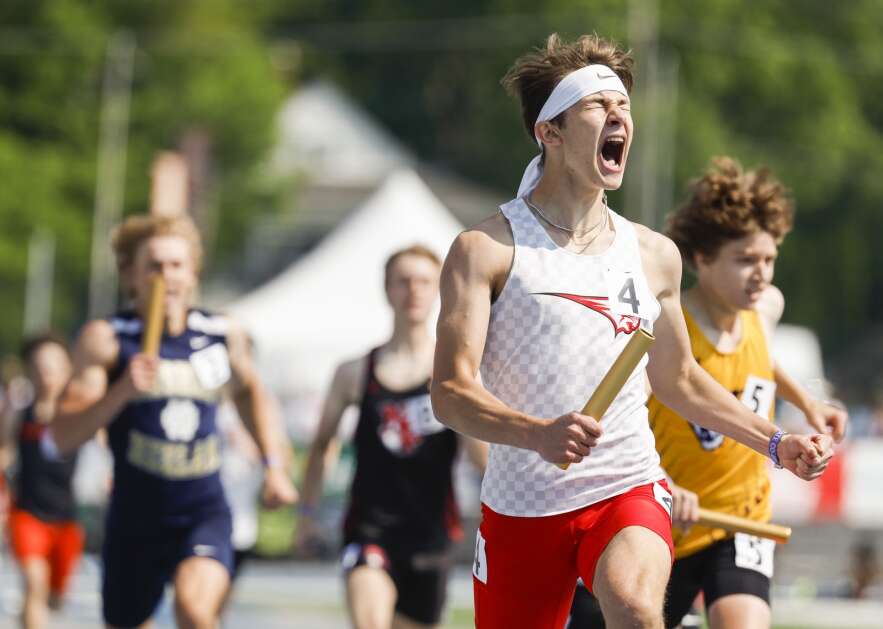 Western Dubuque's Ian Fagan celebrates anchoring the Bobcats to the Class 3A boys’ state track and field sprint medley relay championship Saturday at Drake Stadium in Des Moines. (Jim Slosiarek/The Gazette)