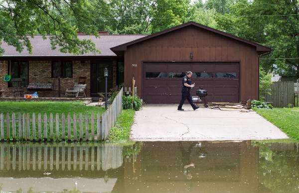 Even as water rises, residents resist leaving beloved neighborhoods