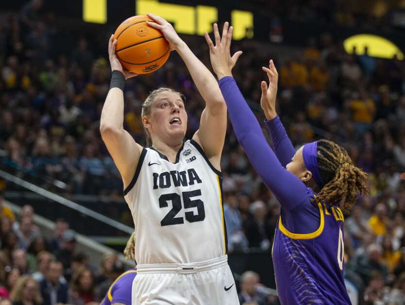 Iowa Hawkeyes forward Monika Czinano (25) shoots the ball with pressure from LSU Lady Tigers forward LaDazhia Williams (0) in the first quarter during the National Championship game at the American Airlines Center in Dallas, Texas on Sunday, April 2, 2023. (Savannah Blake/The Gazette)