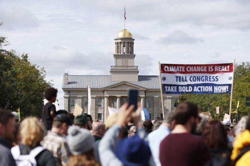 A crowd gathers in October in downtown Iowa City to rally with Swedish teen climate activist Greta Thunberg. The 2020 Democratic presidential hopefuls are in agreement about taking action on climate change, but the details of how they would do so vary by candidate. (Liz Martin/The Gazette)