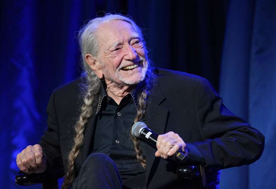 Willie Nelson receives the LBJ Liberty and Justice For All Award at a gala and musical tribute at the LBJ Presidential Library in Austin, Texas, on Friday May 12, 2023. The proceeds from the gala will benefit the newly established Willie Nelson Endowment for Uplifting Rural Communities. (Jay Janner/Austin American-Statesman via AP)