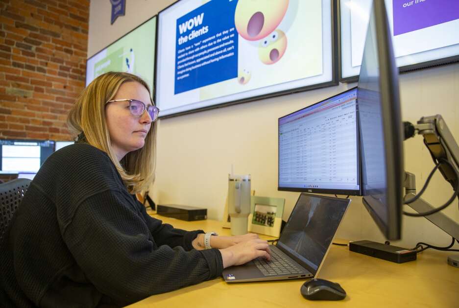 Digital marketing strategist Amanda Hoffman works Tuesday at Informatics Inc. in Cedar Rapids. She’s been with the web design and marketing company for more than four years. (Savannah Blake/The Gazette)