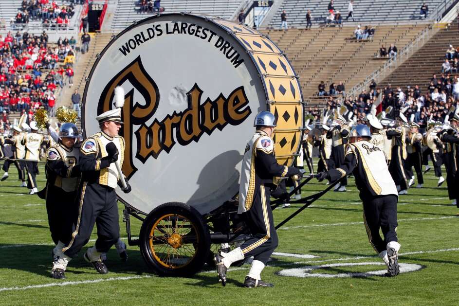 Members of the Purdue Marching Band and the "World's Largest Drum" perform at the Ohio State/Purdue NCAA college football game in West Lafayette, Ind., Saturday, Nov. 12, 2011. (AP Photo/Michael Conroy)