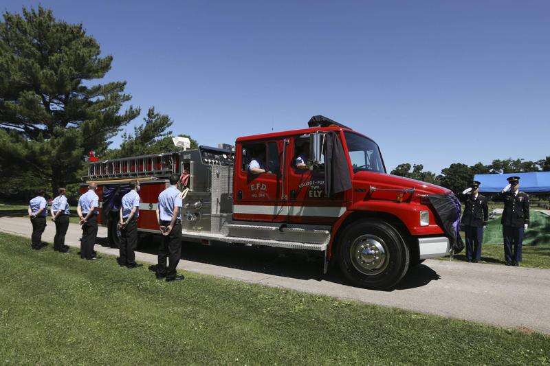 Fire truck parade for deceased Ely firefighter