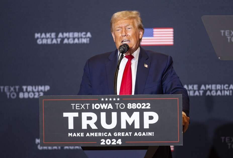 Former President Donald Trump speaks Saturday to a large crowd about what he would change if elected to the White House during a visit at the DoubleTree by Hilton Convention Complex in Cedar Rapids. (Savannah Blake/The Gazette)