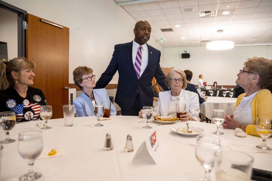 U.S. Sen. Tim Scott greets supporters during a June 9, 2022, event at Elmcrest Country Club in Cedar Rapids. The event featured a panel discussion with Republican Sen. Joni Ernst of Iowa and Scott, of South Carolina, hosted by Iowa GOP Chair Jeff Kaufmann. (Nick Rohlman/The Gazette)