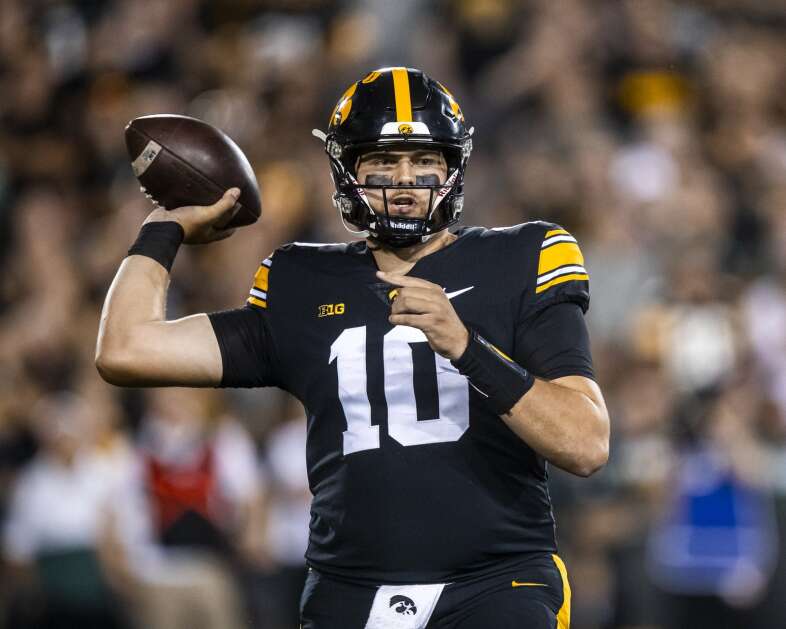 Iowa Hawkeyes quarterback Deacon Hill (10) throws a pass during a game between the Iowa Hawkeyes and the Michigan State Spartans at Kinnick Stadium in Iowa City, Iowa on Saturday, September 30, 2023. (Nick Rohlman/The Gazette)
