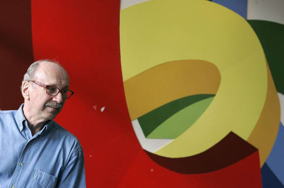 Cedar Rapids artist Stan Wiederspan stands in front of a mural he created that was on display in July 2011 at the U.S. Cellular Center in Cedar Rapids. Wiederspan had been an art professor at Iowa Wesleyan College when he moved to Cedar Rapids in 1973 to become director of the Cedar Rapids Art Center, a job he left five years later. He stayed in the city, opening a gallery, continuing his painting and becoming a major contributor to the public art scene in Linn County. (Jim Slosiarek/The Gazette)