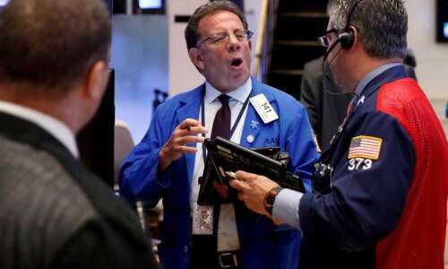 Stocks hit record highs as oil rises