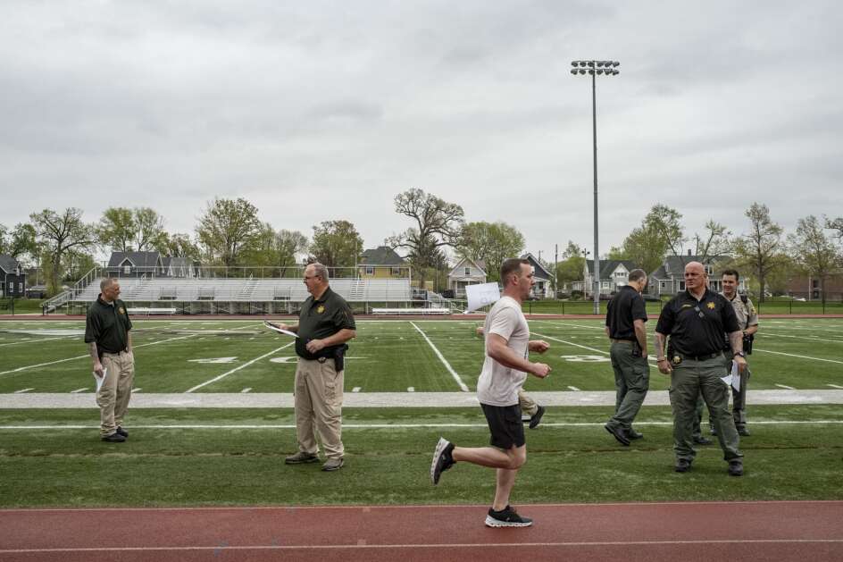 Derrick Sexton, 37, of Norway, Iowa, completes the mile-and-a-half run during testing for law enforcement applicants hosted by the Linn County Sheriff's Office at Coe College in Cedar Rapids. (Nick Rohlman/The Gazette)